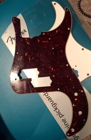 Precision Pickguards...'62 reissue Fender tort and a '83 Squier SQ white PG