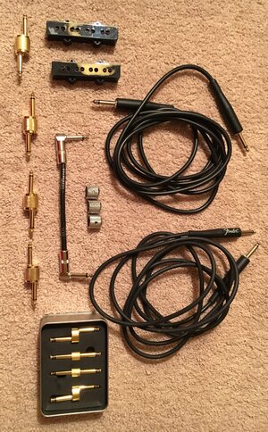 Cables, j pup covers, couplers, knobs, patch cord lot.