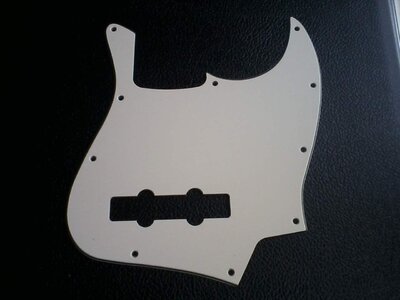 Jazz pickguards, white jazz knobs, tug bar