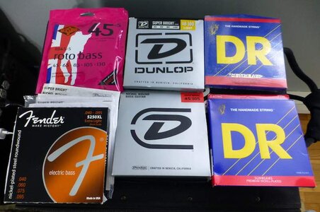 NEW bass strings lot. DR, Dunlop, Rotosound, Fender. 6 sets + 5 low B