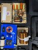 Box of speaker parts and hardware