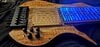 SVS Designs 8 string headless fretless w/ LED fret lines.