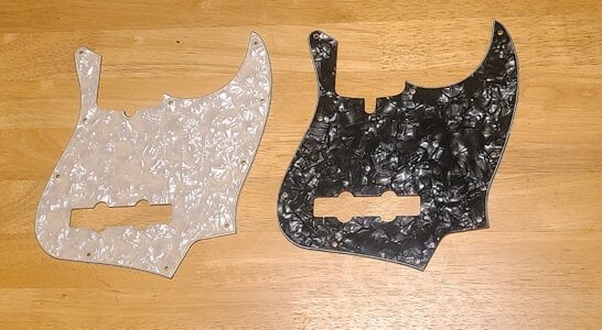 Jazz bass pickguards, black and aged pearl.