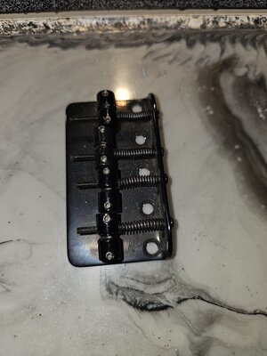 Fender black 4 string bridge