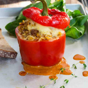 Stuffed peppers with meat sauce and cheese baked